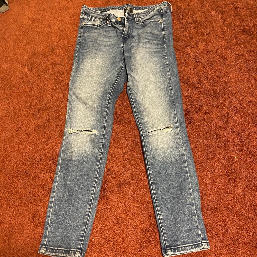 Mid rise medium wash ripped jeans
